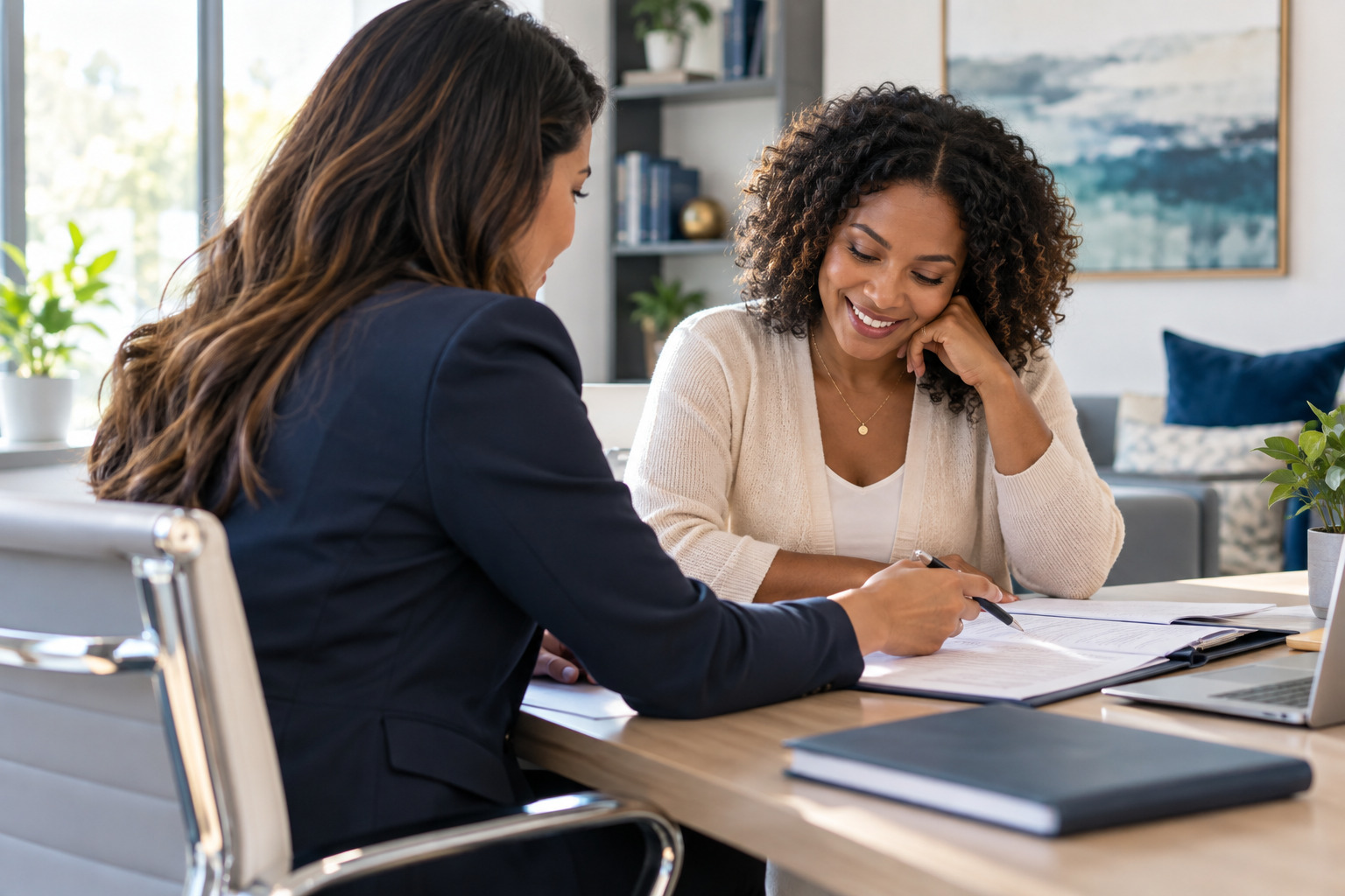 A financial advisor and client reviewing paperwork together